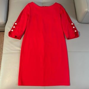 Red dress, used but like new! Zipper is on the back.With pearl buttons